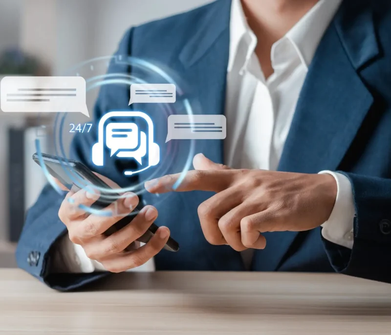 Businessman,With,Chat,Bot,Icon,On,Virtual,Interface.,24-7,Chatbot