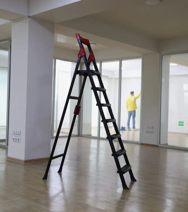 High,Ladder,Standing,In,Center,Of,Empty,Office.,Rent,New